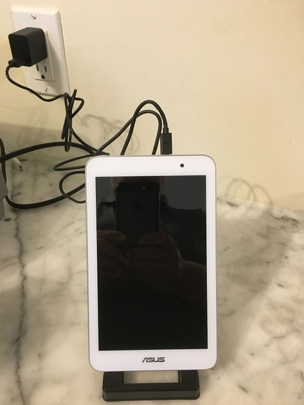 Photo of Lifeshield wireless security touchpad on a counter.