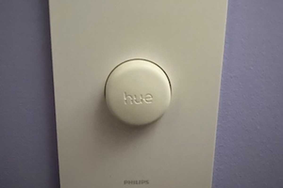 photo of philips hue smart button on the wall