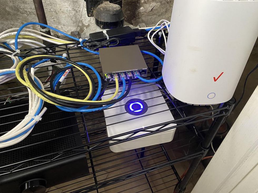 Photo of Ring Alarm Pro Base Station Installed next to our modem.