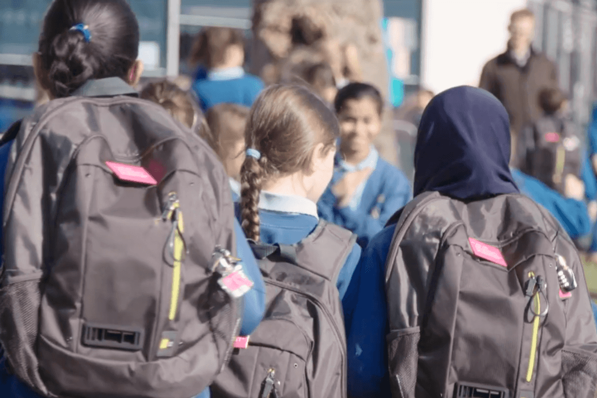 Photo of schoolchildren wearing Dyson air quality-monitoring backpack
