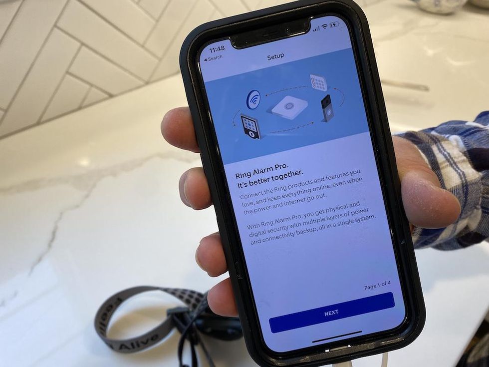 Photo of smartphone showing the setup screen in the Ring app