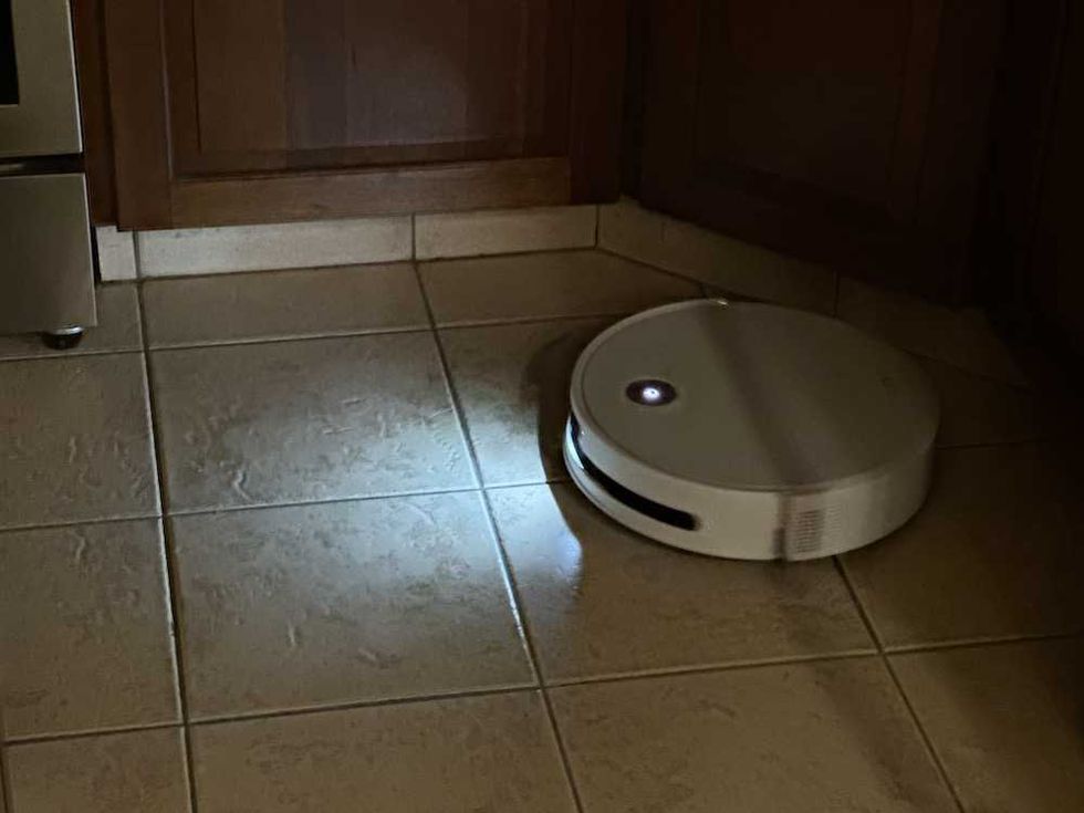 photo of Yeedi M16 Infinity clearning the floor at night