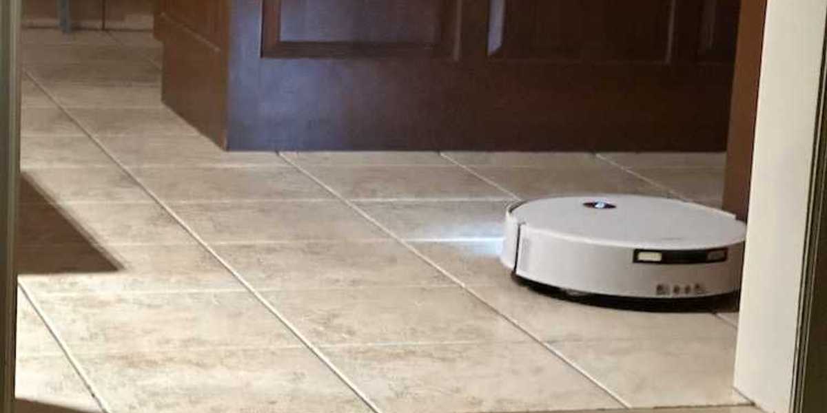 photo of Yeedi M16 Infinity vacuuming the floor with lights on