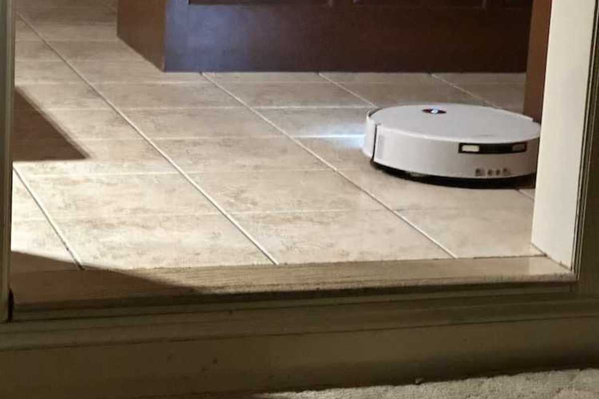 photo of Yeedi M16 Infinity vacuuming the floor with lights on