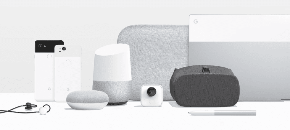 Picture of all google assistant enabled devices on a table.