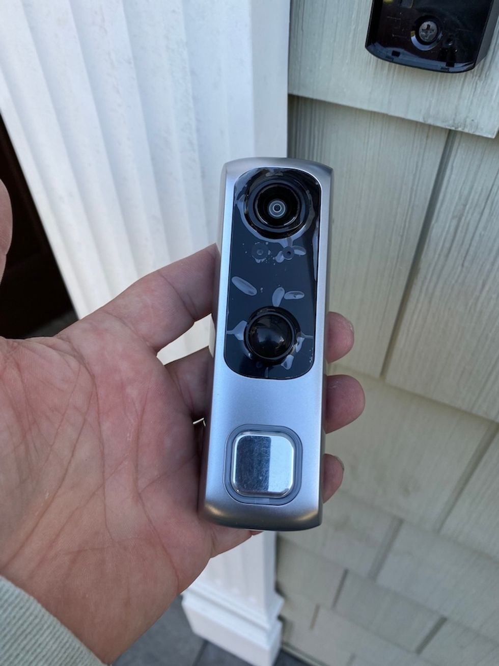 Picture of lifeshield video doorbell prior to snapping on to mounting bracket.