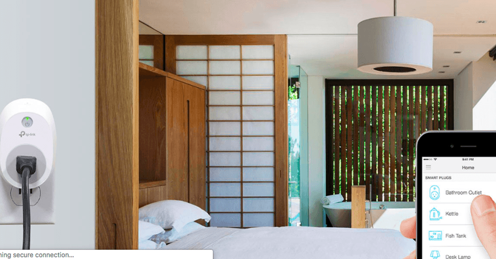 Picture of TP-Link Smart Wi-Fi Plug plugged in to a wall outlet.