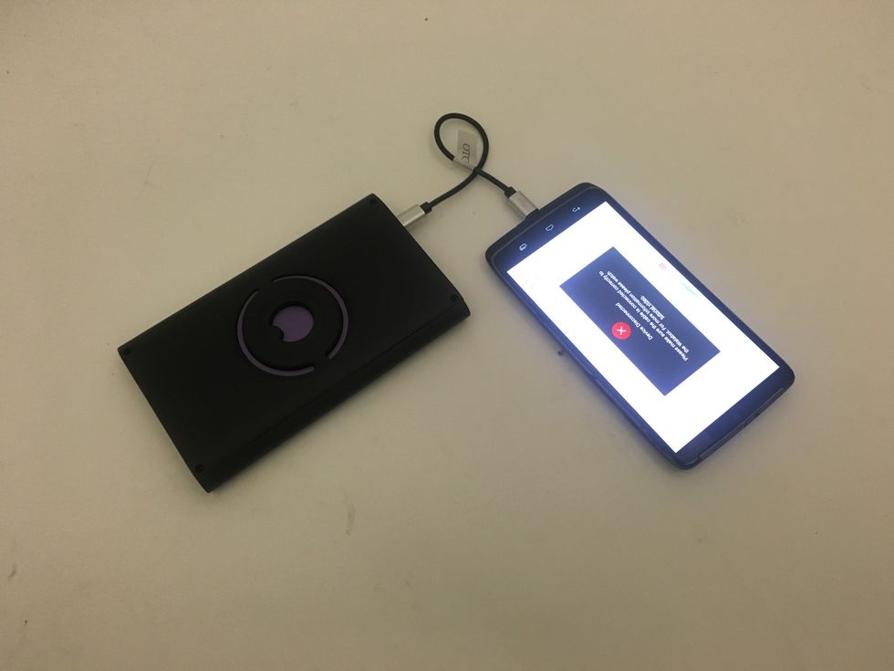 Picture of Walabot connected to a smartphone.