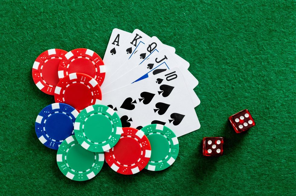 Playing cards and gambling chip on the table stock photo