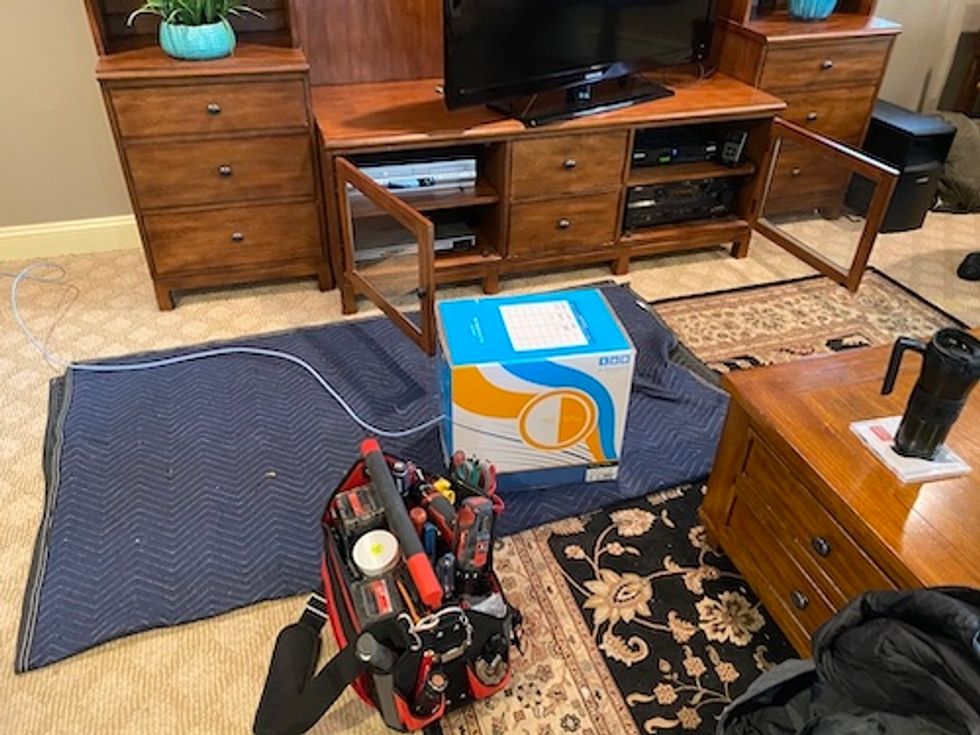 Prepare for installation in your home by laying down blanket and all their tools.