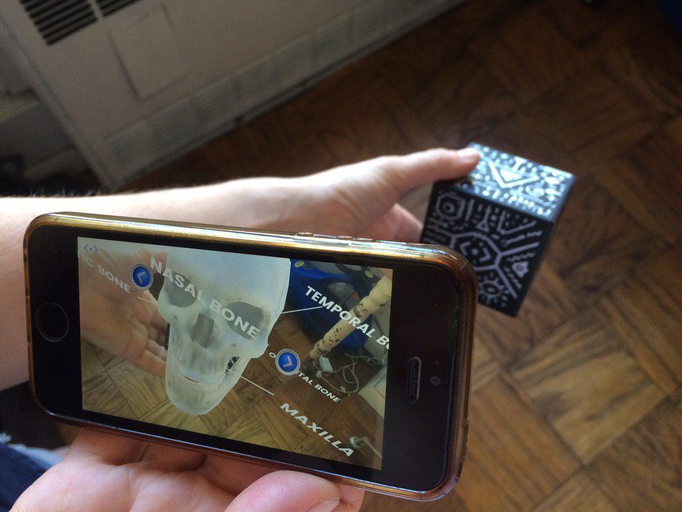 Project hundreds of 3D images on the Merge Cube from a skull to a volcano