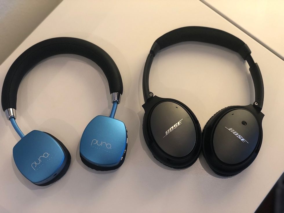 PuroQuiet blue headphones next to Bose black heapdhones