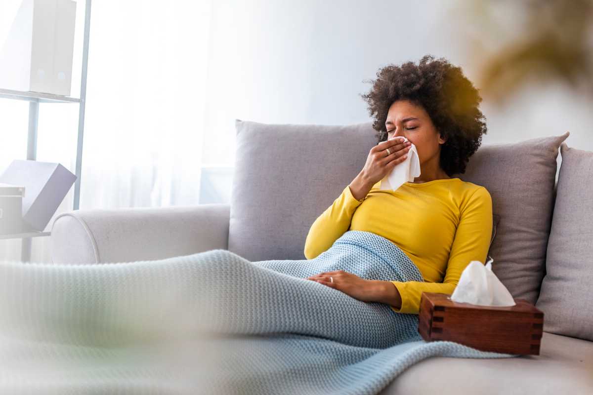 Stock image of a woman with the flu