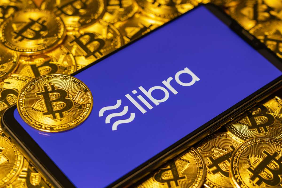 Stock image showing Facebook Libra and bitcoins