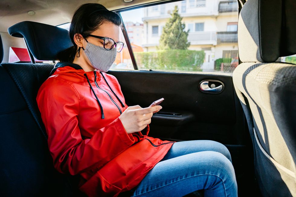 Taxi passenger wearing a mask