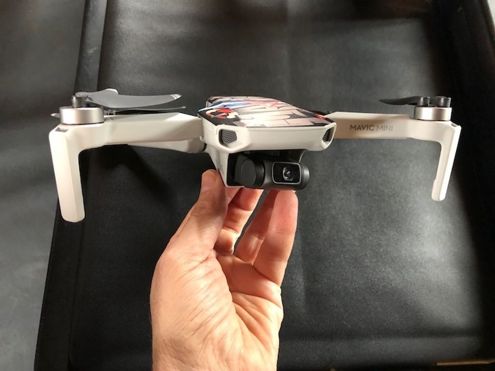 The DJI Mavic Mini being held in the hand
