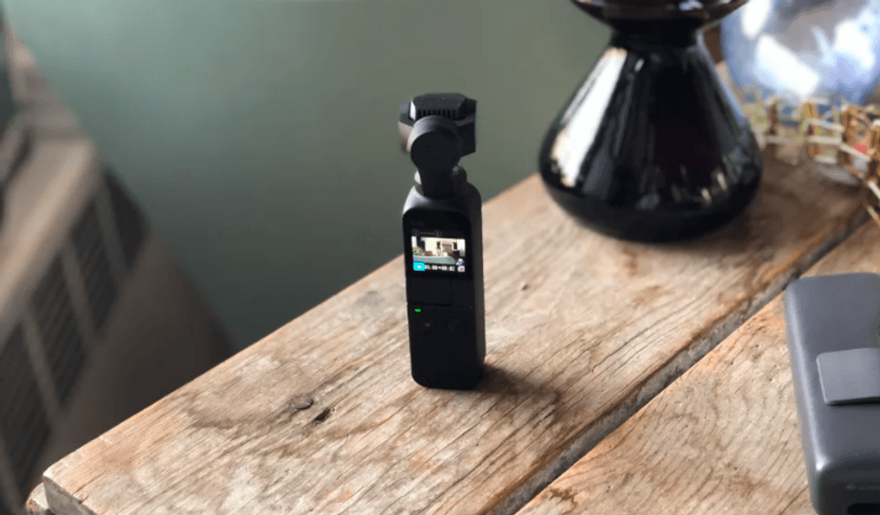 The DJI Osmo Pocket, pictured here, is a tiny video camera that can also shoot time\u00a0lapse videos