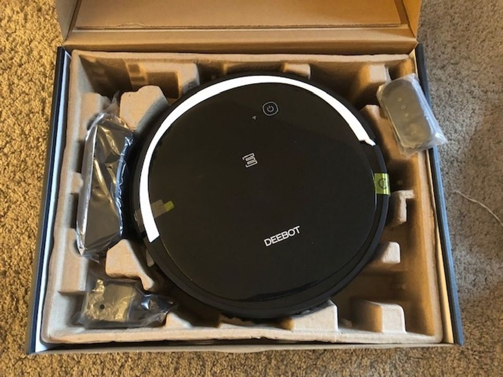 The Ecovacs Deebot 500 robot vacuum in a box