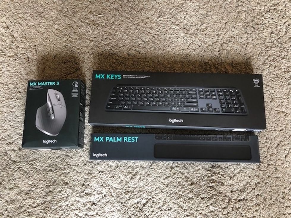 The product boxes for the MX Keys, MX Master 3, MX Palm Rest