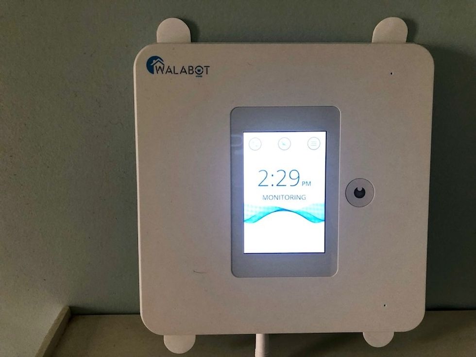 The Walabot Home, pictured here, shows on its screen that it's in monitoring mode