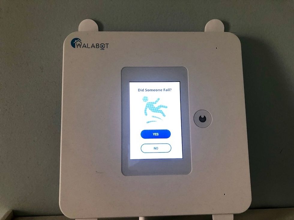 The Walabot Home with an alert on its screen asking if someone has fallen