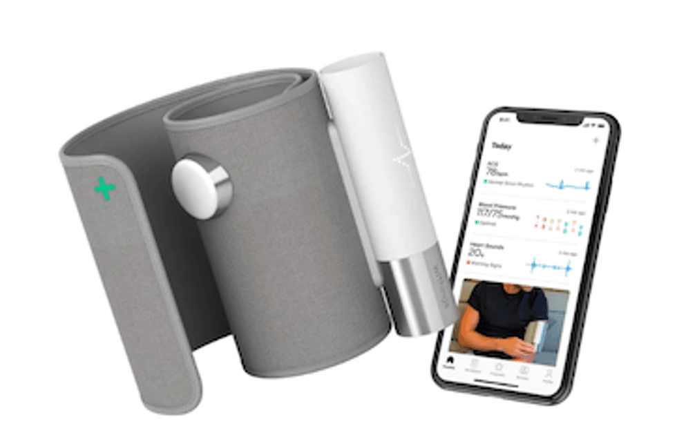 The Withings BPM core with a smartphone opened to its app