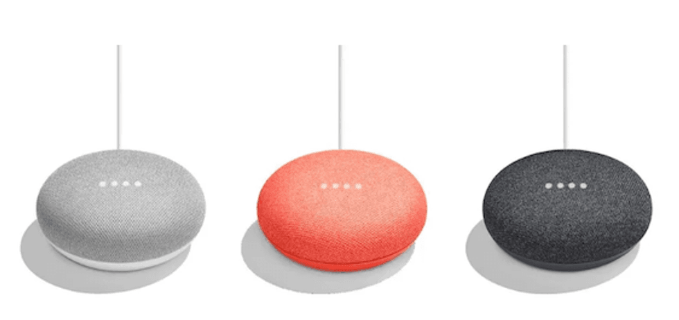 Three Google Home Mini devices in gray, red and black