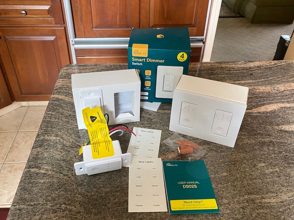 TreatLife Dimmer Switch unboxed on a counter.