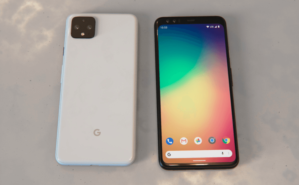Two Google phones on a table, side by side, one on its front and one on its back