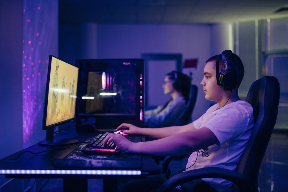 two people playing online video games with high speed internet