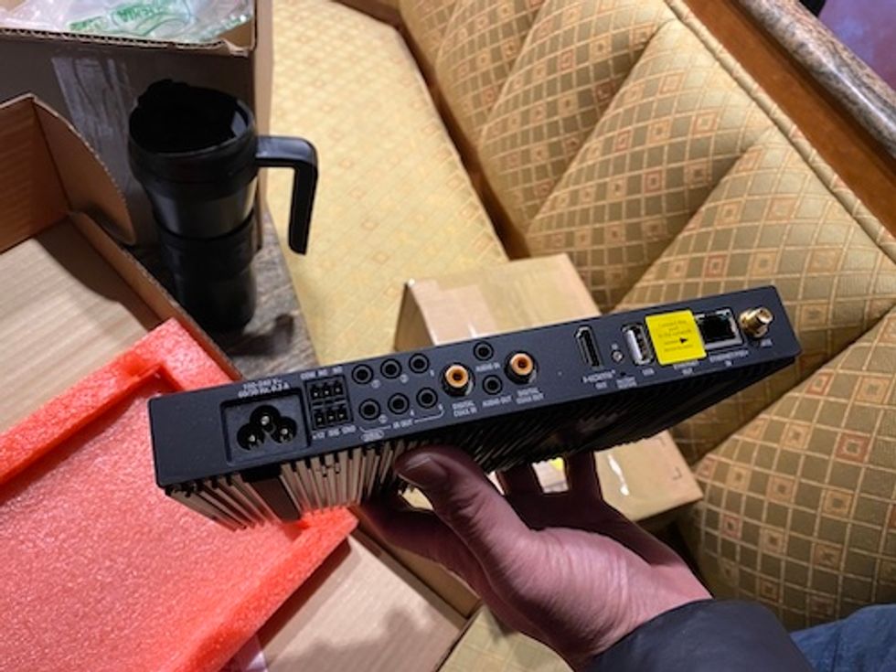 Unboxed Control4 EA-3 controller in a hand