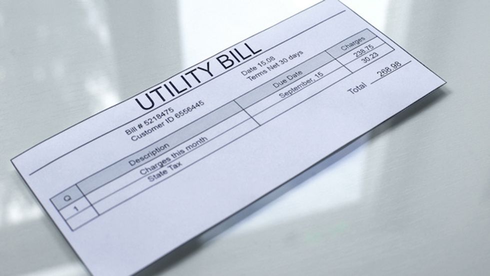 Utility bill lying on table, payment for services, month expenses, tariff
