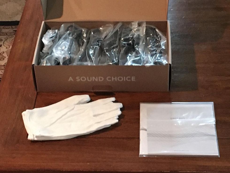 White gloves and power cords for Enclave CineHome II system