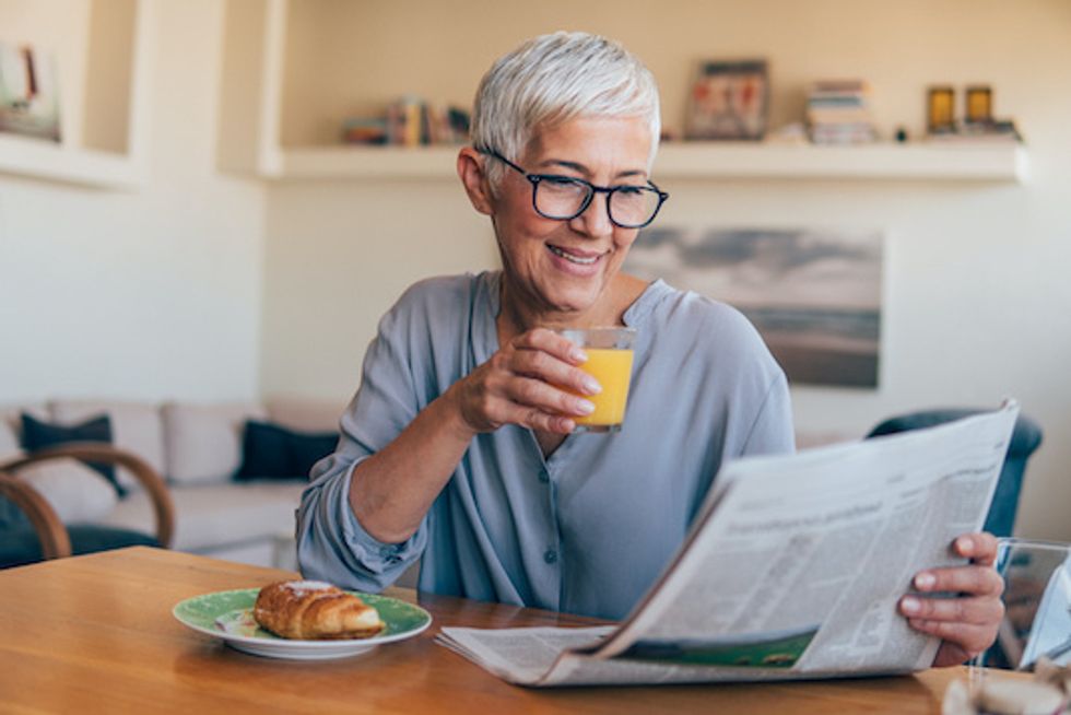 Woman reading newspaper