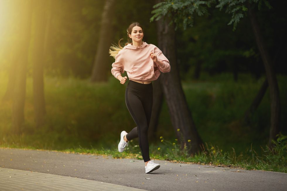 Woman running on the road.