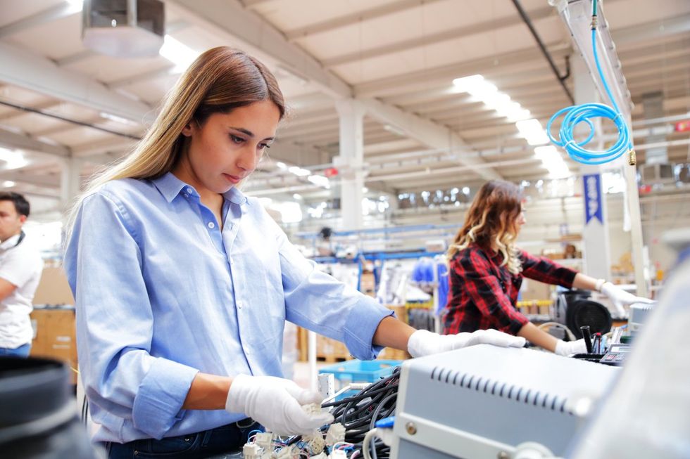 Women working in cable factory stock photo